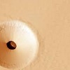 National Aeronautics and Space Administration released a photo of the mysterious hole on Mars.